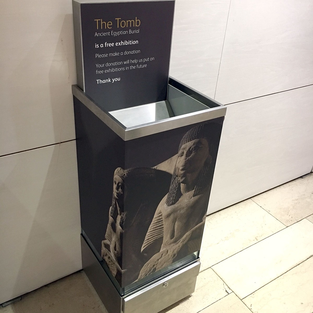 A traditional coin donation box at the National Museum of Scotland 